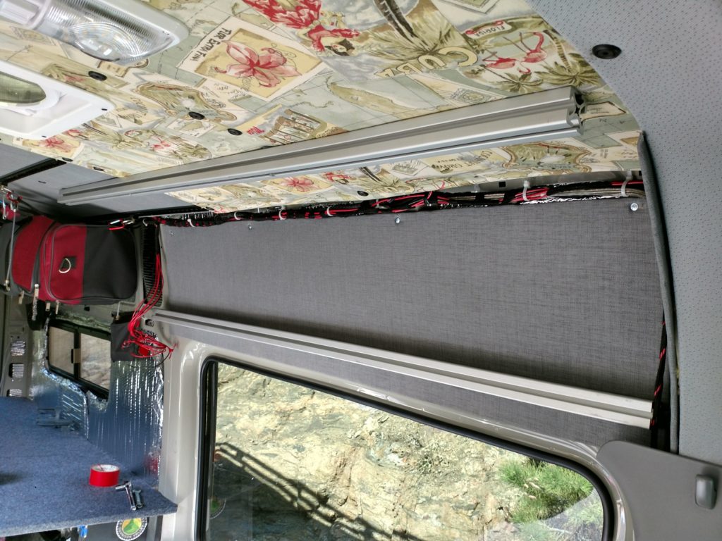 Interior wall panel in place with wiring for the sub-panel roughed in