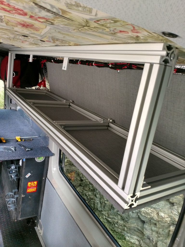 Assembling the cabinet, the separators for the cabinet sections will fit nicely into the slots of the lower 8020 supports