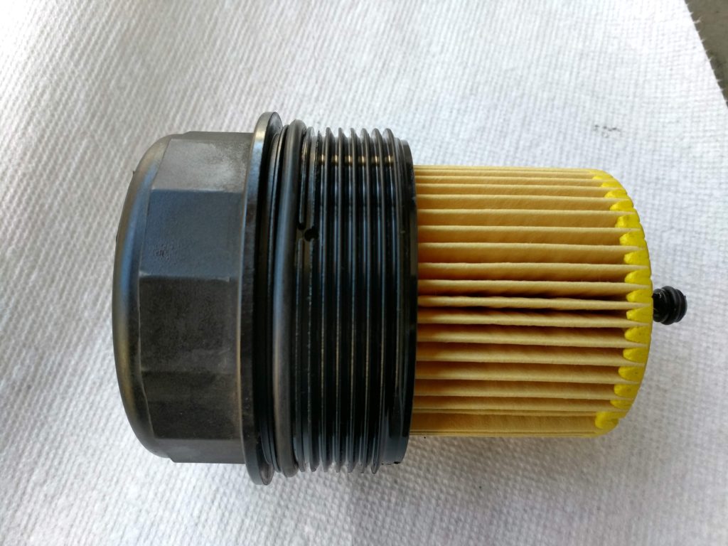 Oil filter housing with new filter and gaskets